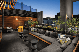 Pet-Friendly Apartments in Koreatown-Pearl on Wilshire-Los Angeles, CA-Modern Outdoor Furniture, Fire Place, Outdoor Plants, and Grey Padded Flooring